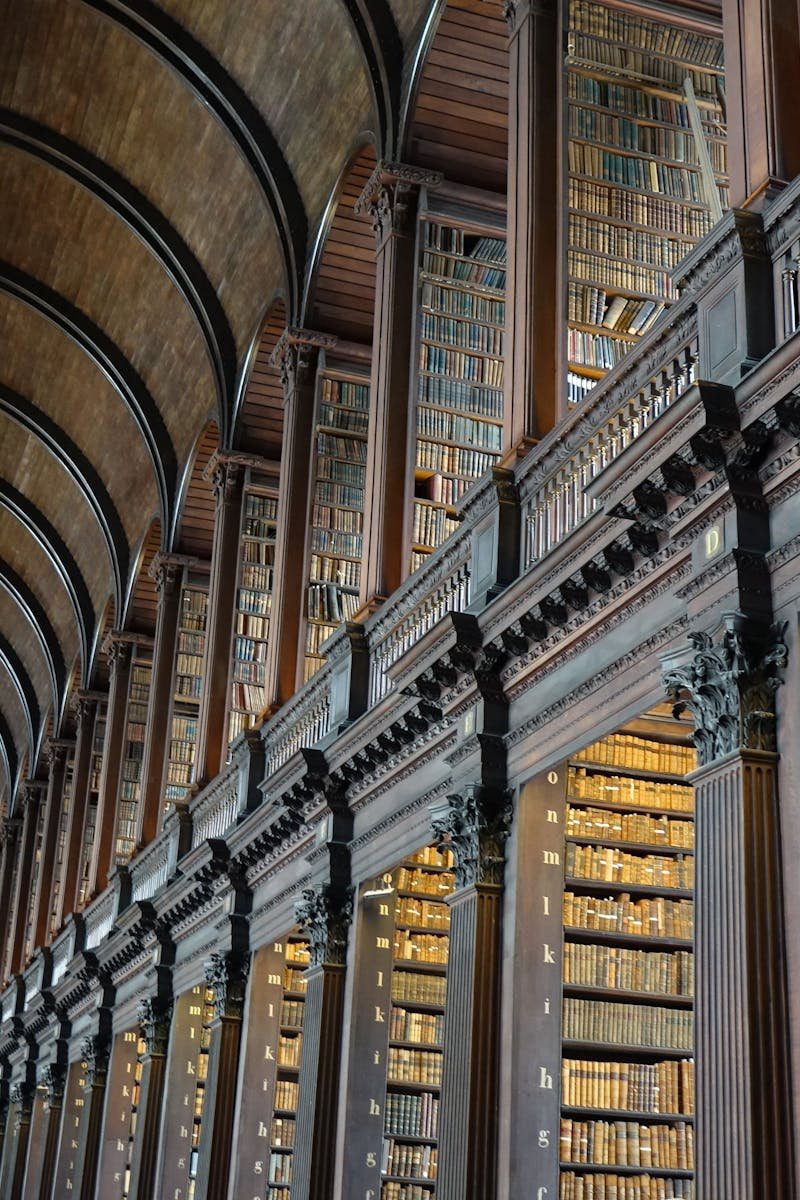 Expansive view of the historic Long Room library in Trinity College Dublin.