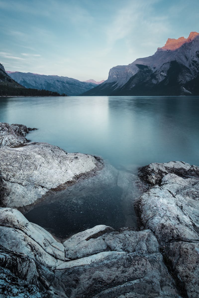 Serene mountain landscape with still lake in Banff, Canada.
