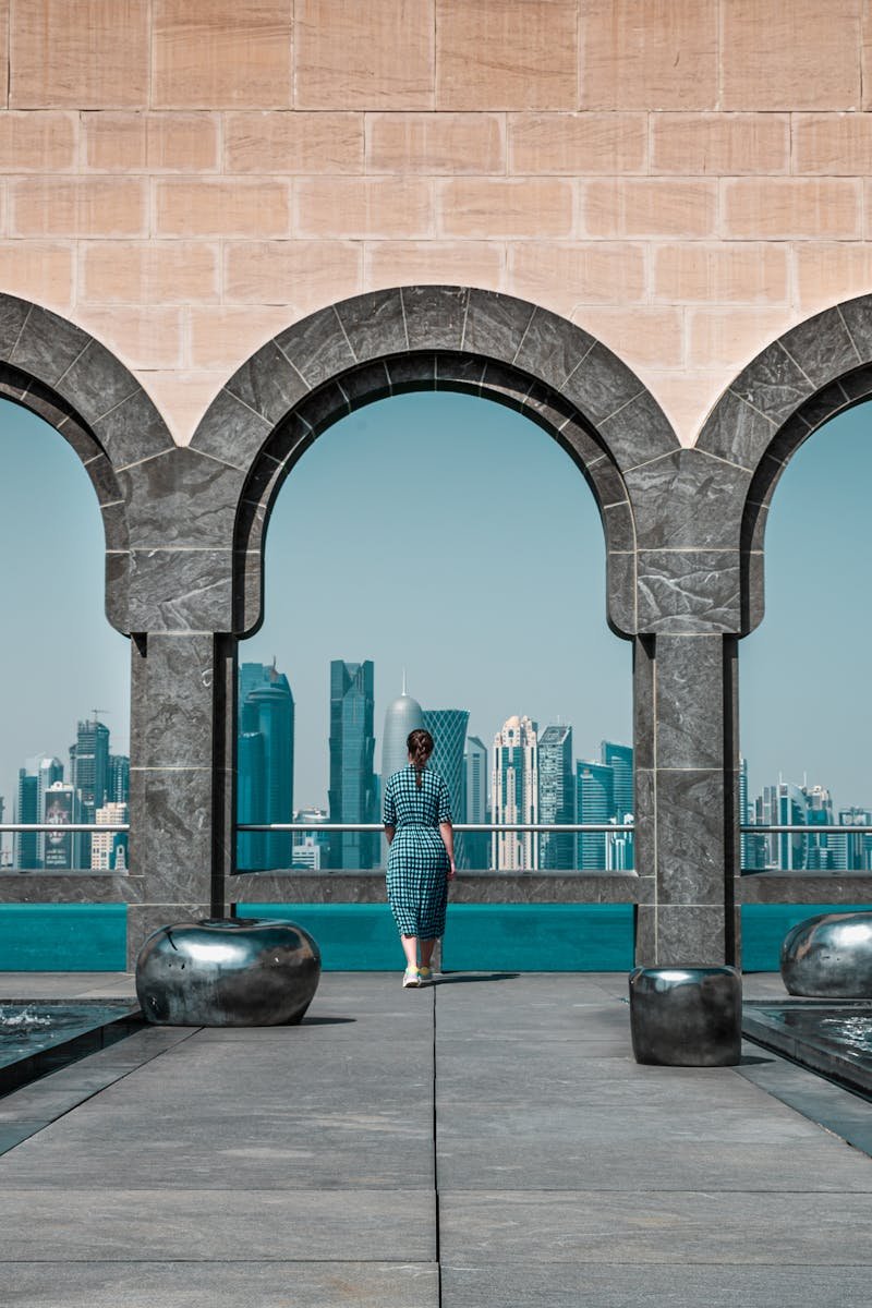 View of Doha skyline through Islamic arches at Museum of Islamic Art, Qatar.
