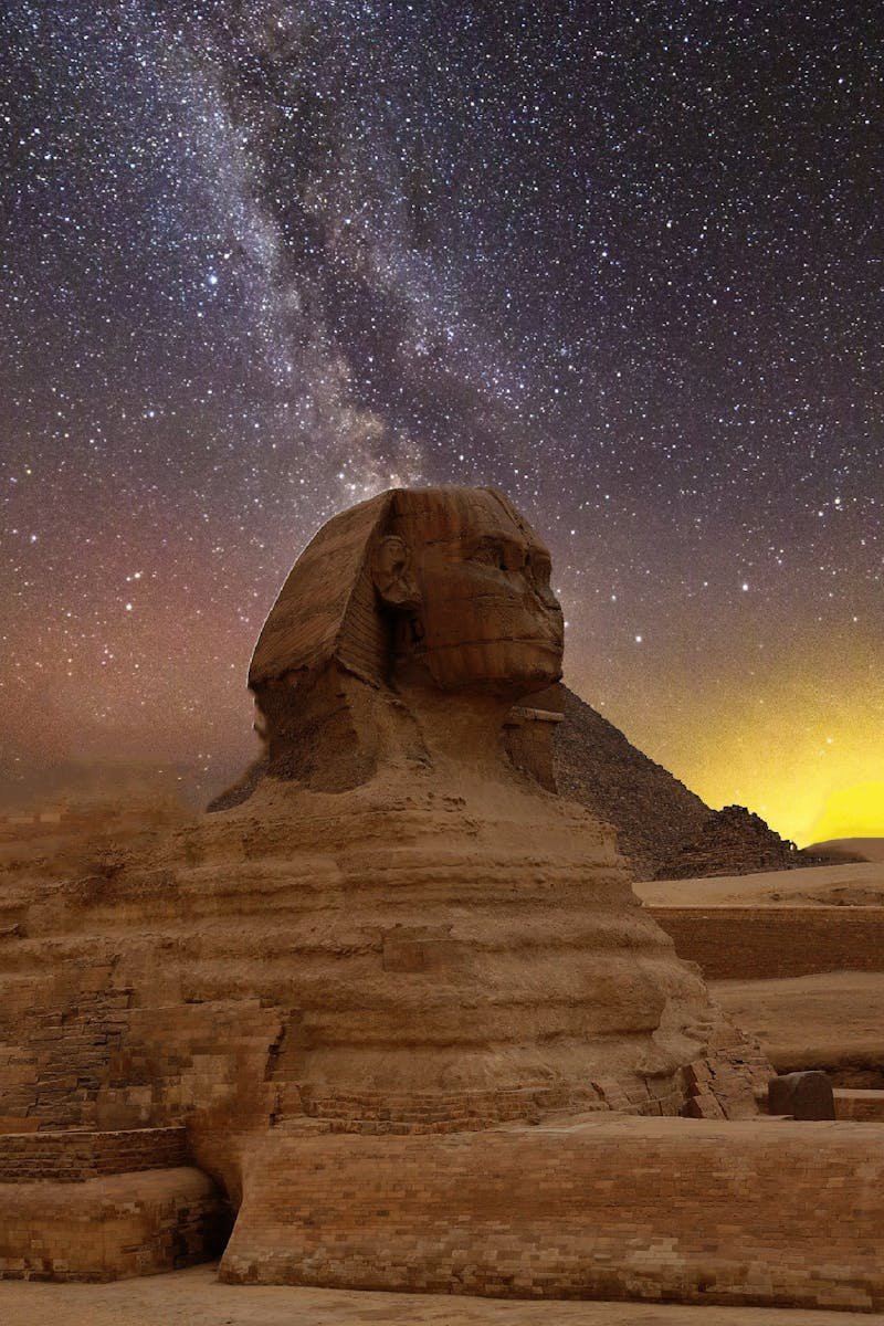 Stunning capture of the Great Sphinx of Giza beneath a star-lit sky with the Milky Way.