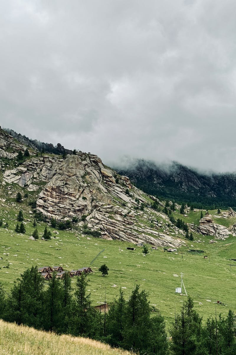 Explore the stunning rugged terrain of Terelj National Park with lush valleys and towering cliffs.