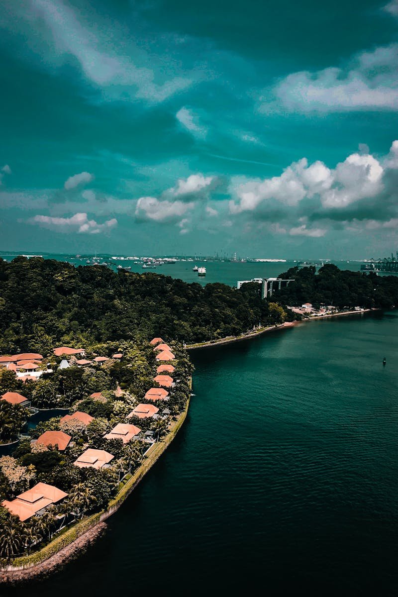 Stunning aerial view of Sentosa Island in Singapore featuring coastal beauty and lush greenery.