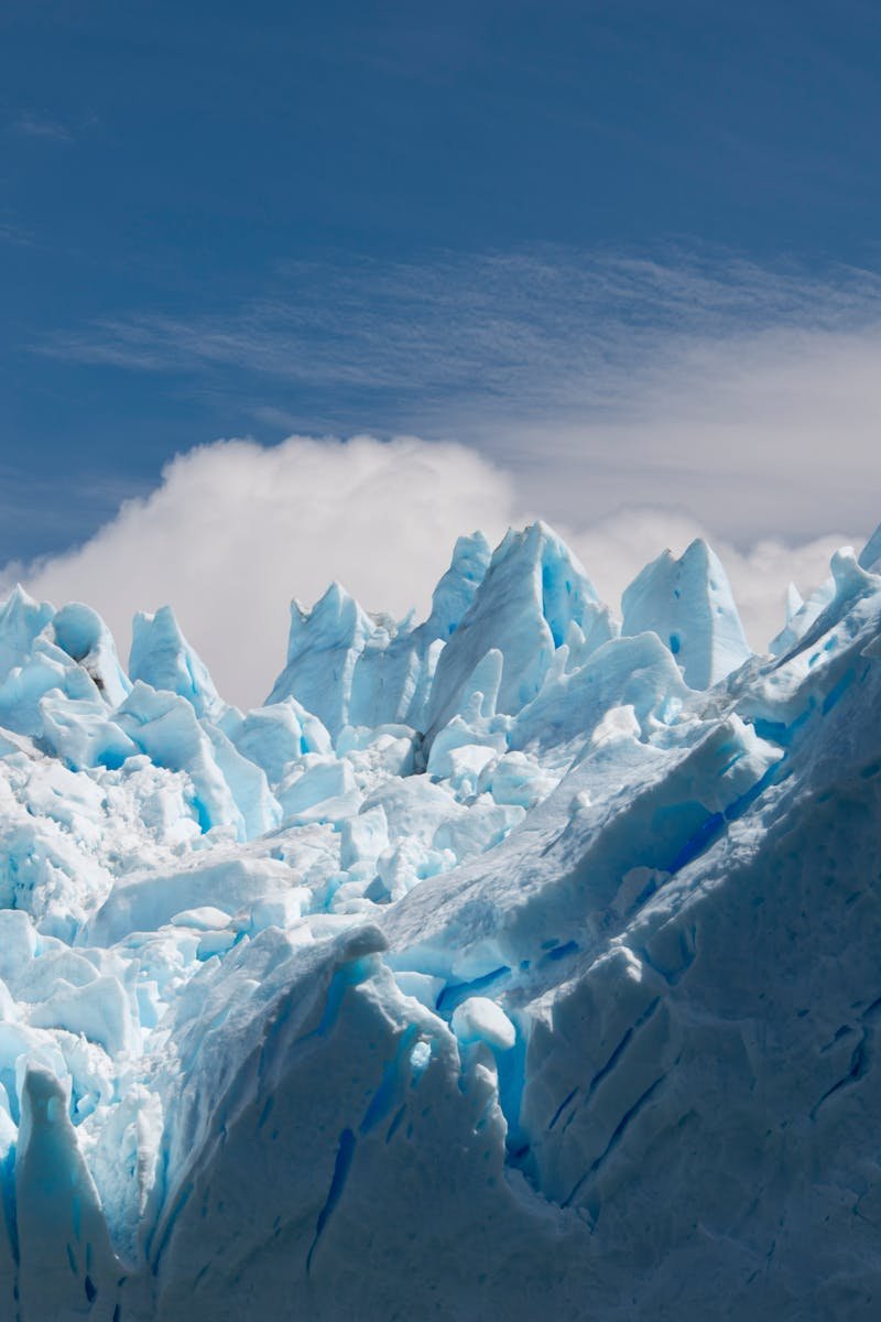 Stunning view of sharp iceberg peaks against a bright blue sky in Argentina.