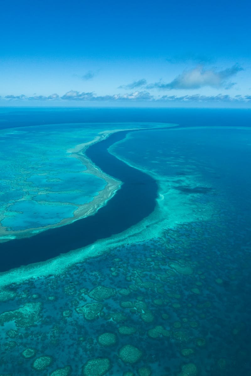 Spectacular aerial view of the vibrant Great Barrier Reef's turquoise waters in Australia.